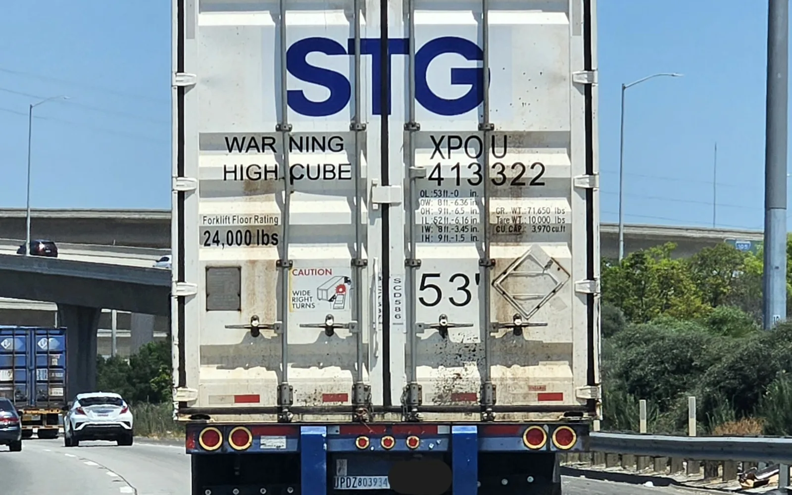 Shipping containers stacked at an industrial terminal